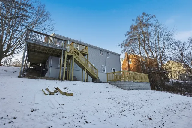 a view of a house with a snow in the yard