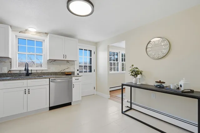 a kitchen with a sink cabinets and appliances