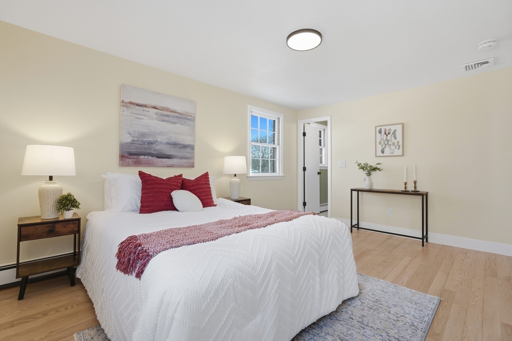 108 Cherry Street Framingham, MA 01701 - Photo 8 of 30 a bedroom with a bed and a night stand