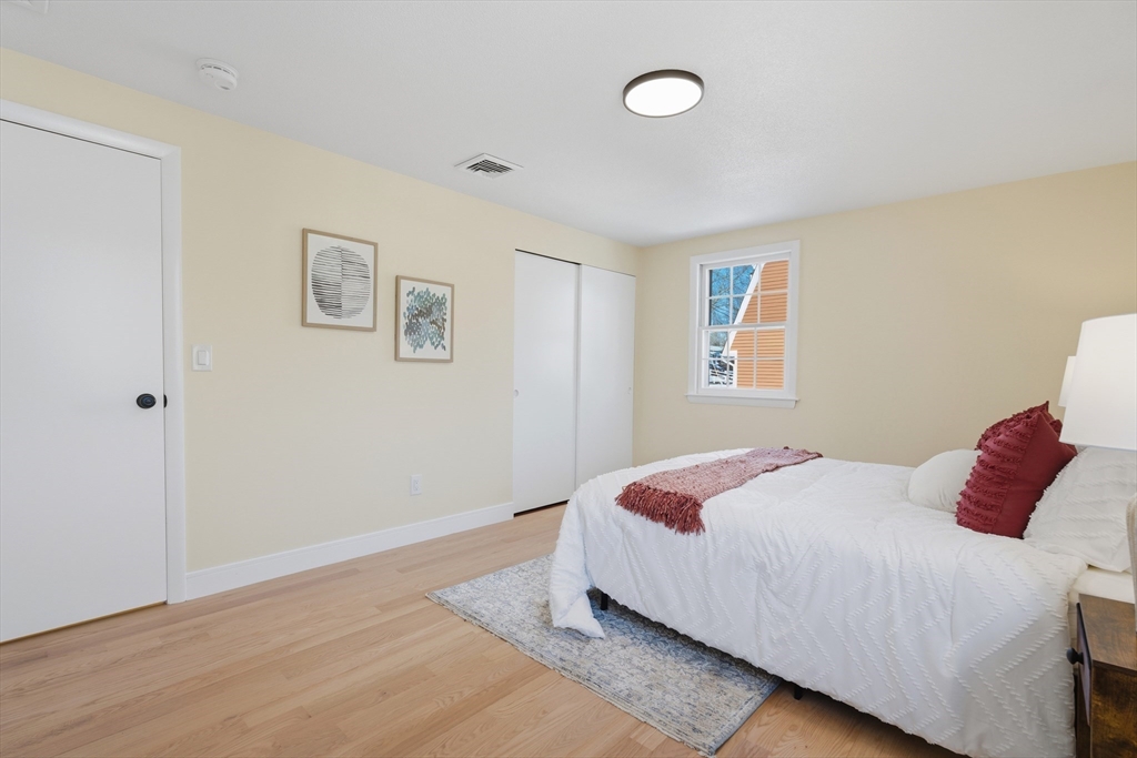 108 Cherry Street Framingham, MA 01701 - Photo 9 of 30 a bedroom with a bed and a window
