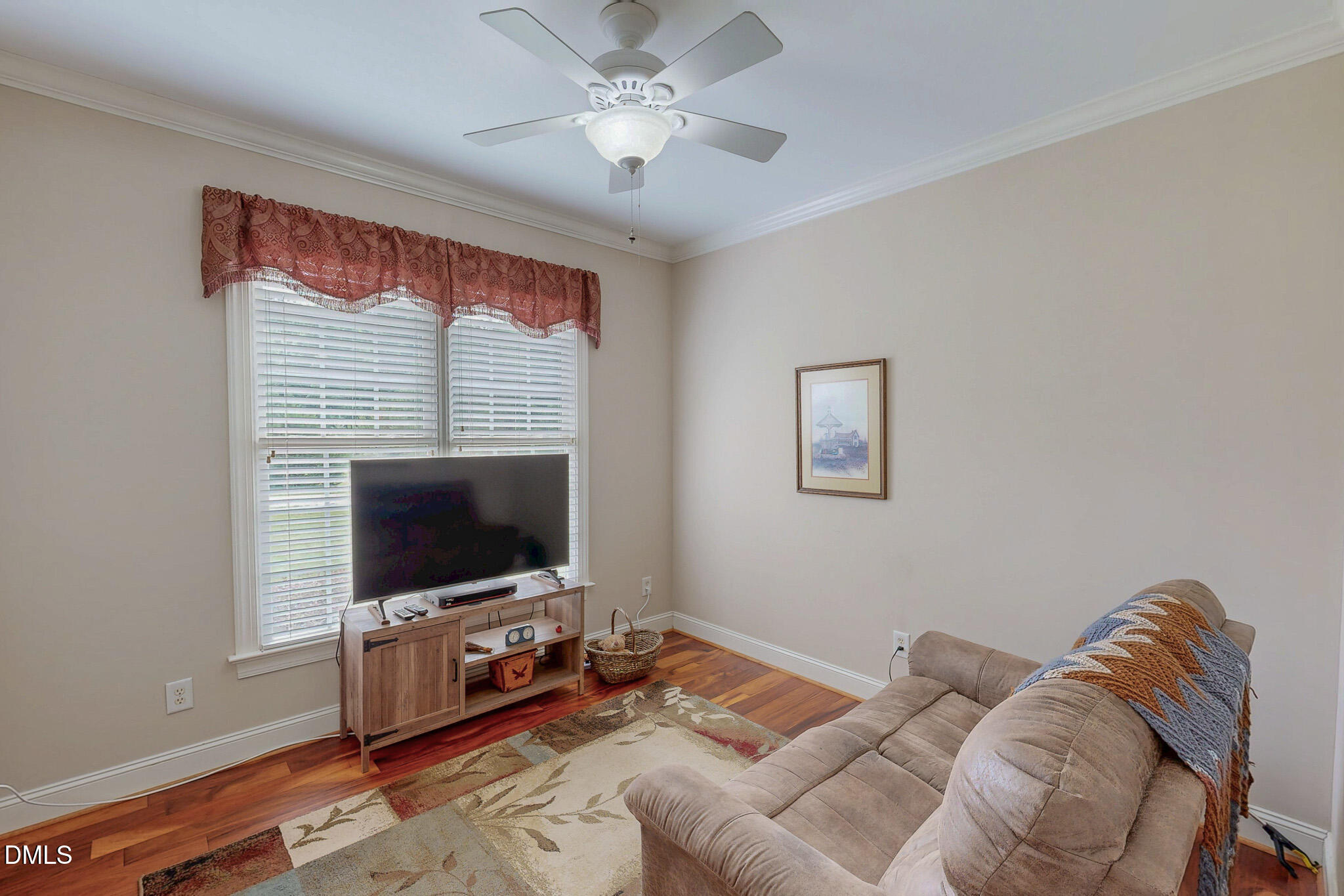 115 Duncan Plantation Road Timberlake, NC 27583 - Photo 37 of 48 a living room with furniture and a flat screen tv