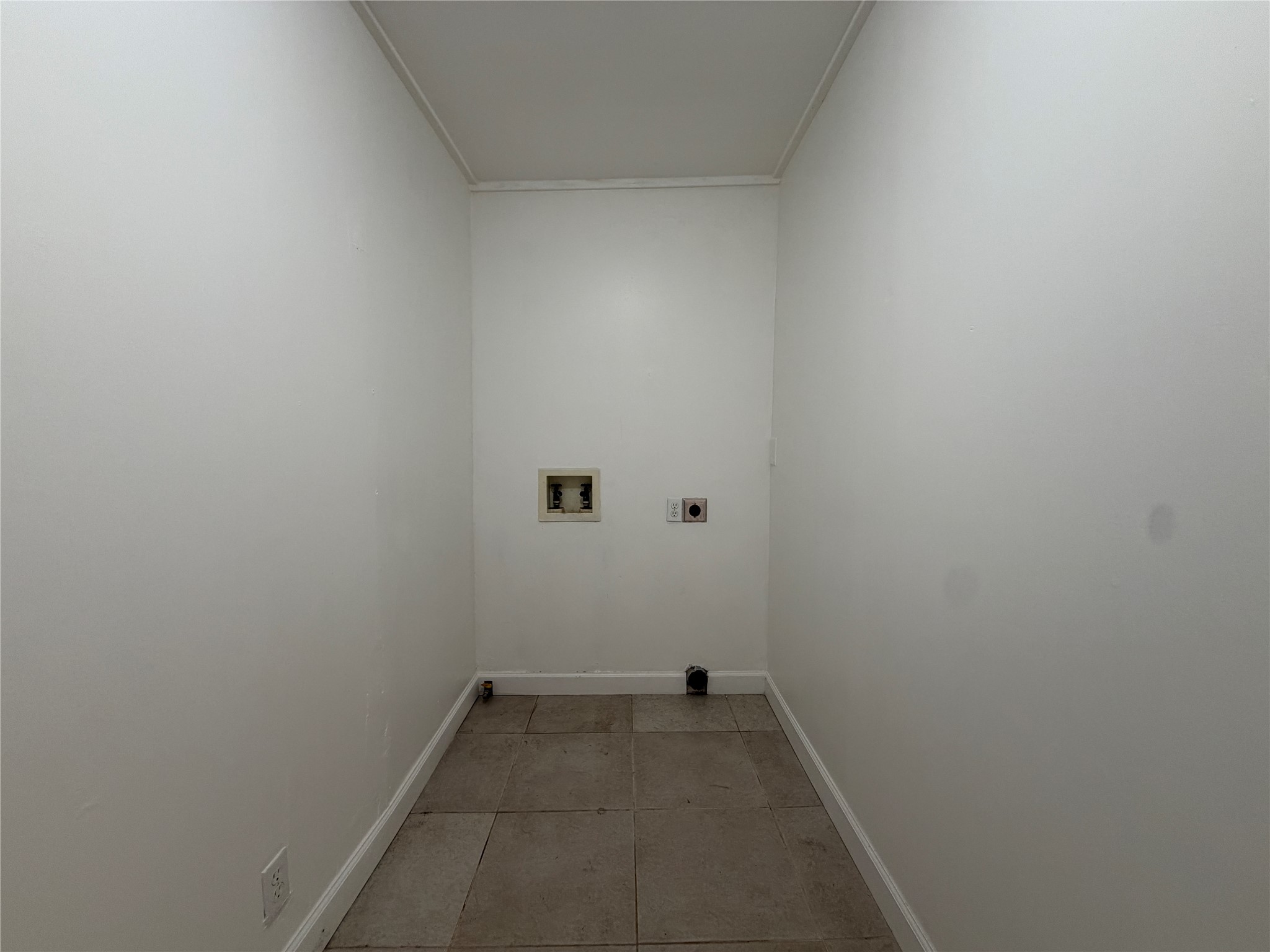 5310 Presidio Road Austin, TX 78745 - Photo 31 of 31 A dedicated utility space with durable tile flooring awaits your laundry appliances.