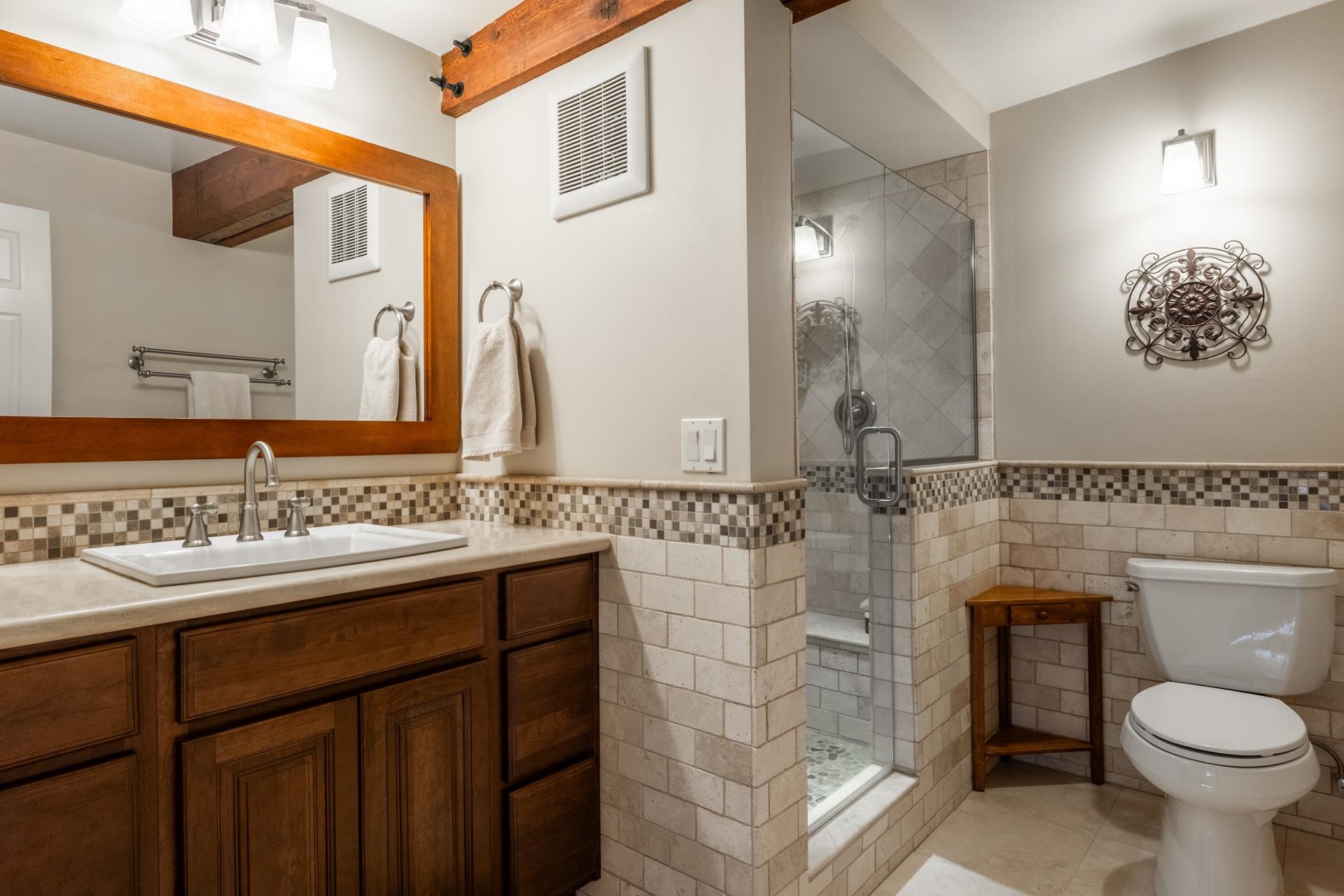 349 Davison Road Mammoth Lakes, CA 93546 - Photo 21 of 43 Bathroom with vanity, a stall shower, tile walls, tile patterned flooring, and wainscoting