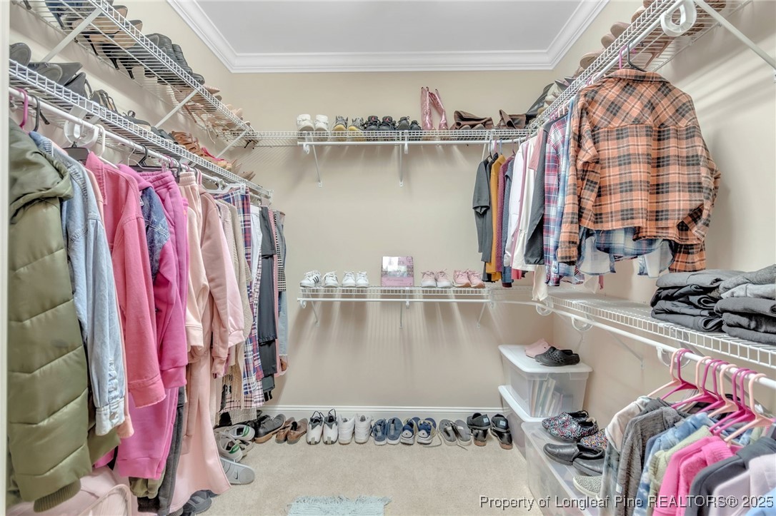 124 Gallery Drive, Unit 302 Spring Lake, NC 28390 - Photo 18 of 33 a view of walk in closet with clothes and shoes
