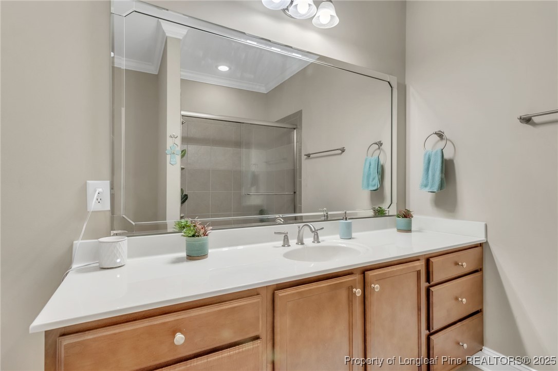 124 Gallery Drive, Unit 302 Spring Lake, NC 28390 - Photo 20 of 33 a bathroom with a sink double vanity and a mirror