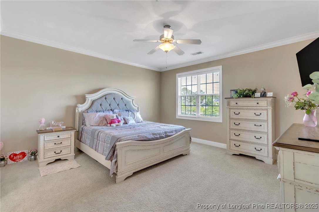 124 Gallery Drive, Unit 302 Spring Lake, NC 28390 - Photo 22 of 33 a bedroom with a bed and a dresser