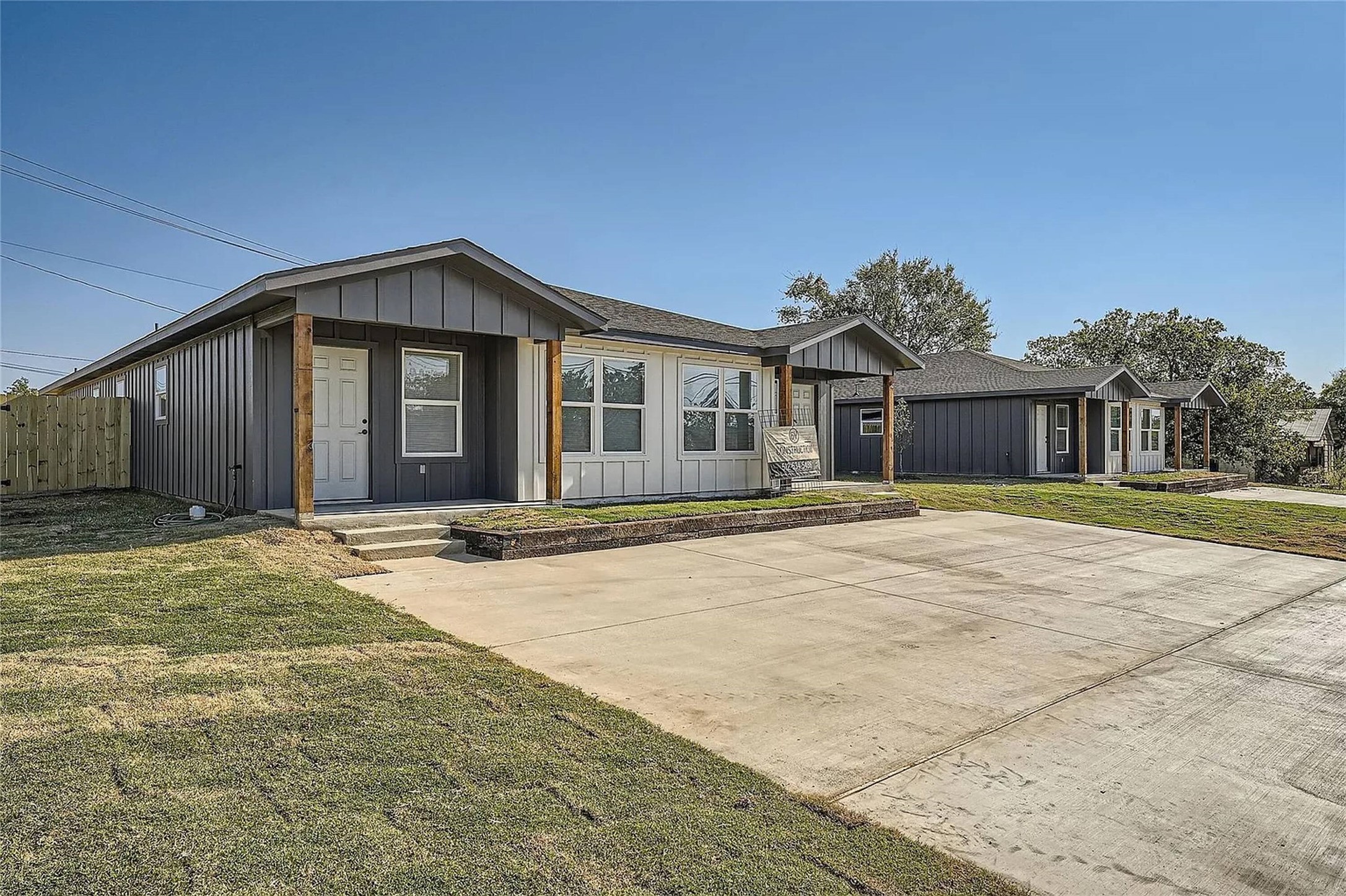 109 Fisher Street, Unit A & B Elgin, TX 78621 - Photo 2 of 9 a front view of a house with a garden