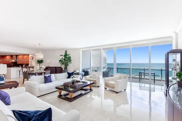 a living room with furniture and a table