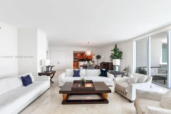 a living room with furniture or couch and a potted plant
