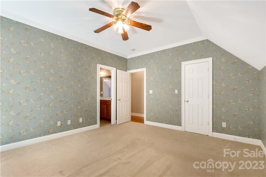 1504 Greyfox Estates Road Lancaster, SC 29720 - Photo 40 of 45 an empty room with closet and a chandelier fan