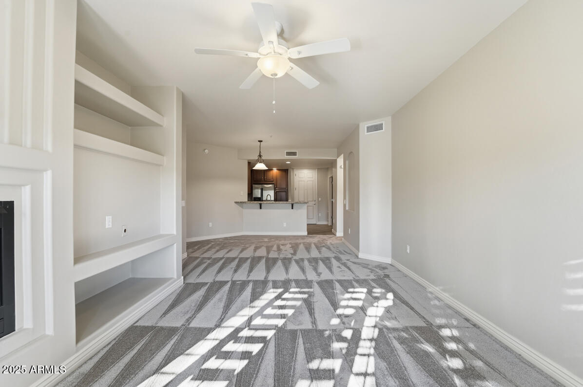 5450 East Deer Valley Drive, Unit 2024 Phoenix, AZ 85054 - Photo 16 of 50 a view of empty room with wooden floor