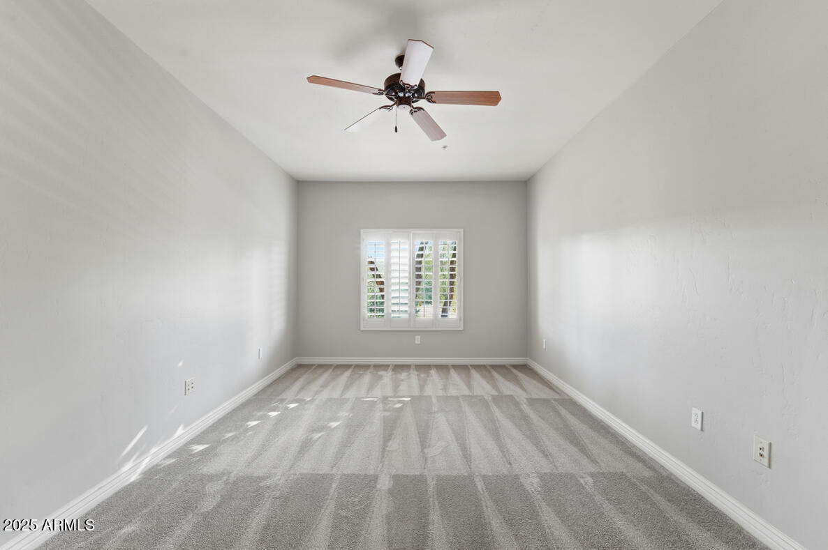 5450 East Deer Valley Drive, Unit 2024 Phoenix, AZ 85054 - Photo 21 of 50 wooden floor in an empty room with a window