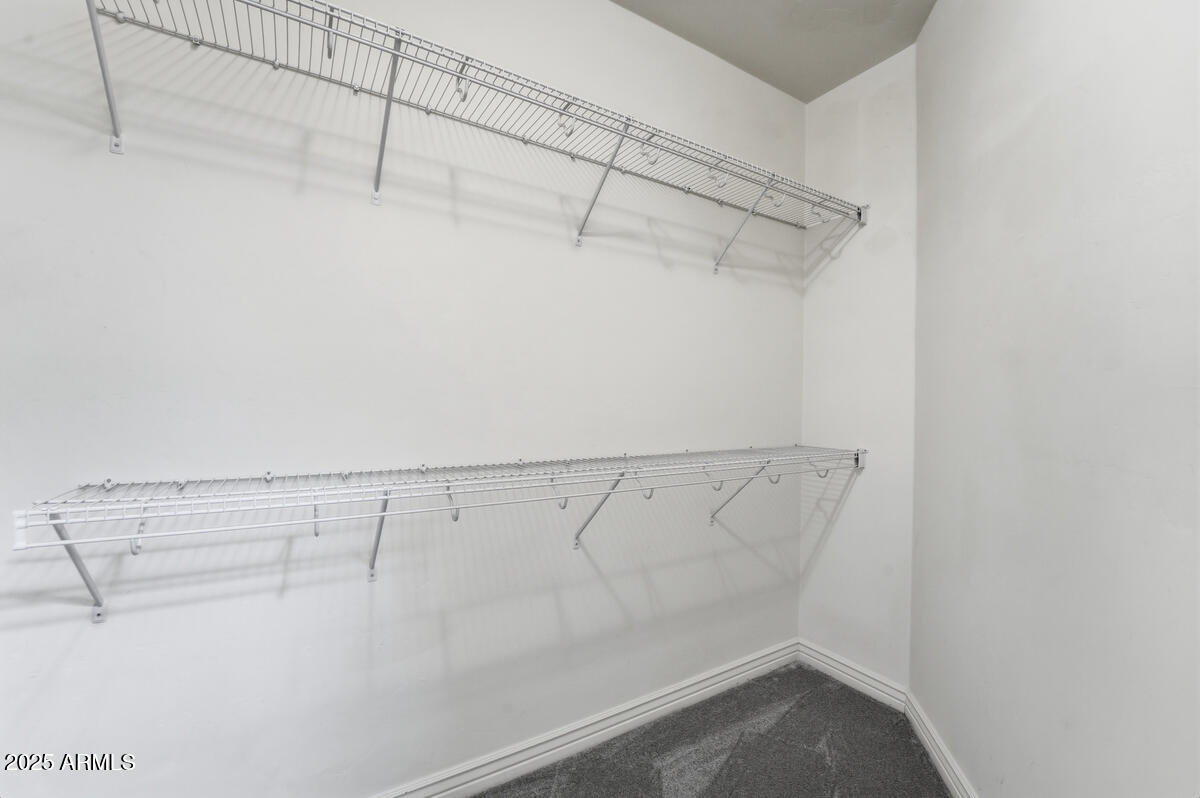 5450 East Deer Valley Drive, Unit 2024 Phoenix, AZ 85054 - Photo 25 of 50 a view of a room with racks on the wall