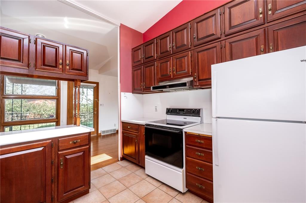 200 Church Avenue Indiana, PA 15701 - Photo 12 of 37 a kitchen with stainless steel appliances granite countertop a refrigerator and a stove top oven