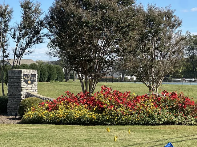 a view of a hallway with wooden cabinet and chandelier