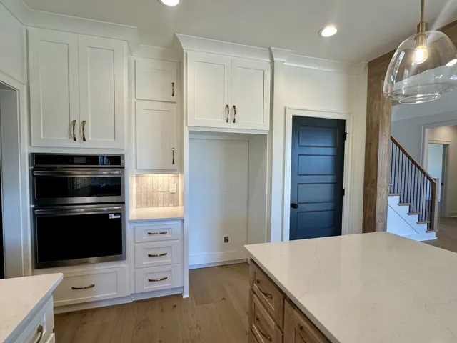 a view of a livingroom with a ceiling fan and a window