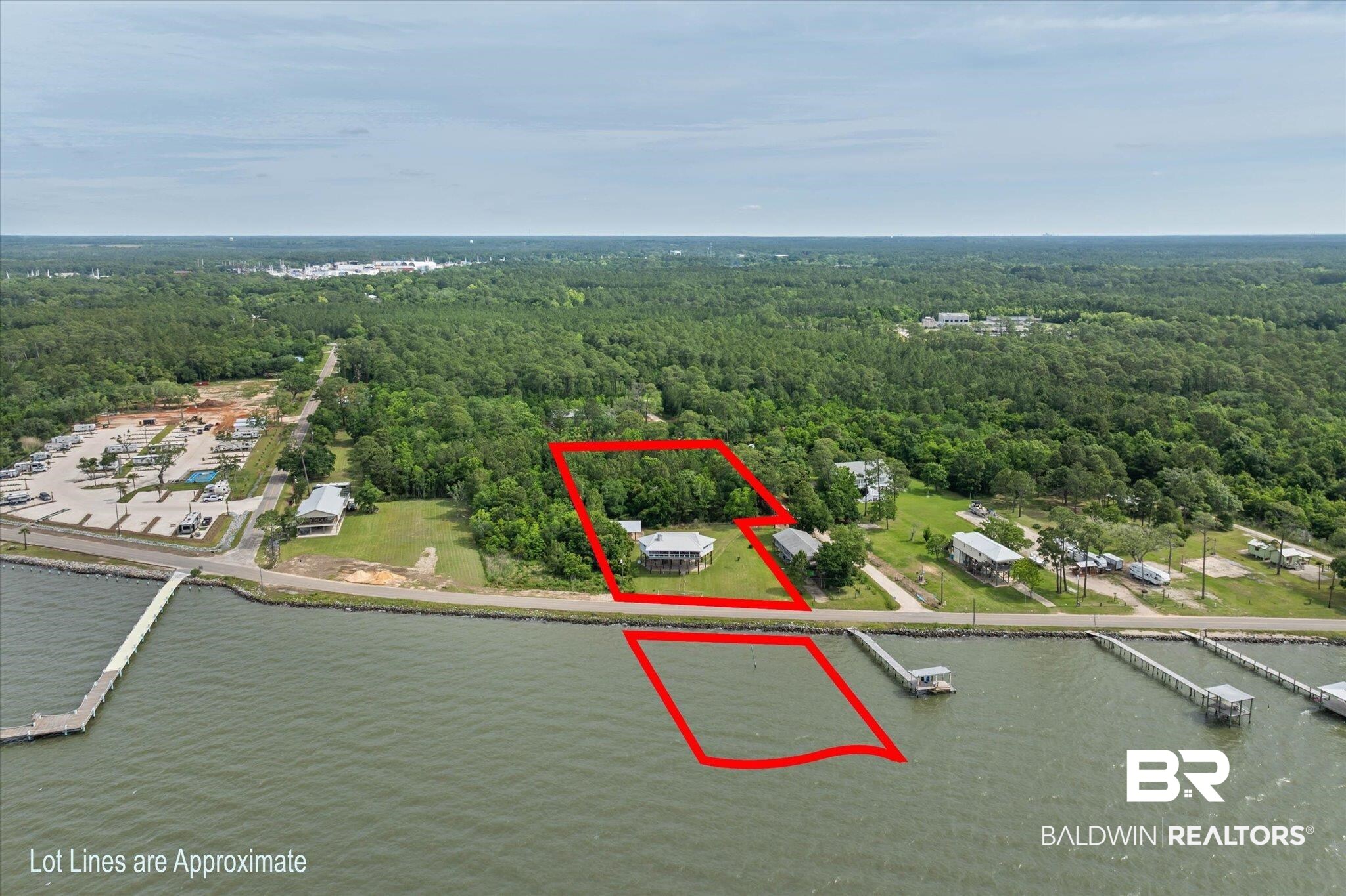 9100 Shell Belt Road Coden, AL 36523 - Photo 25 of 38 Waterfront property featuring a residential structure and a wooded parcel