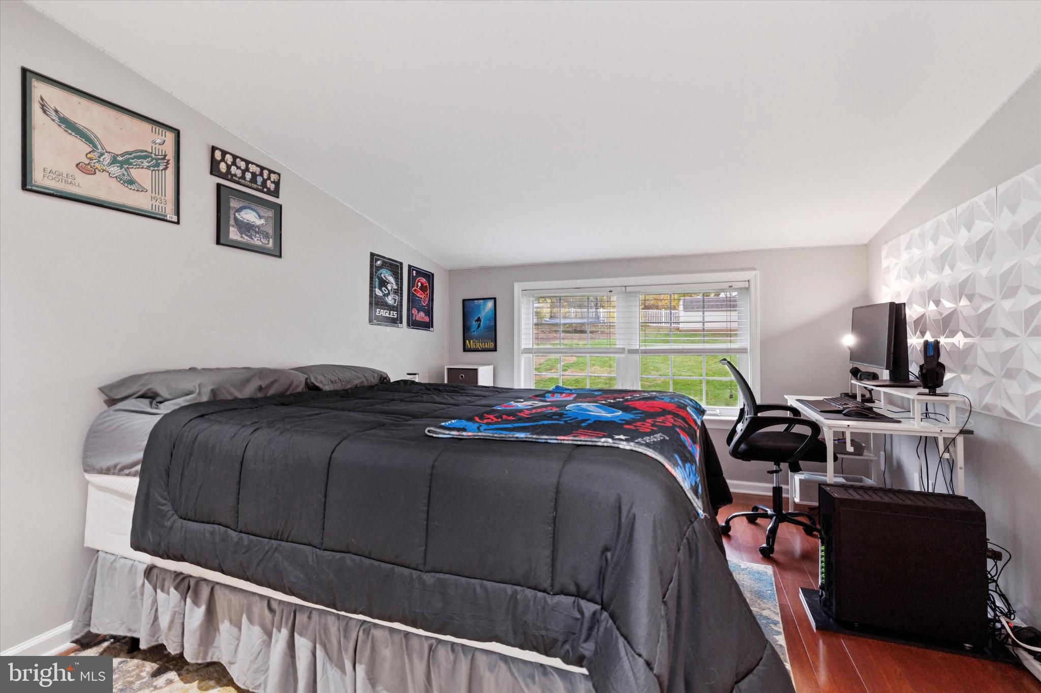 3 Buttonwood Avenue Malvern, PA 19355 - Photo 15 of 25 a bedroom with a bed and wooden floor