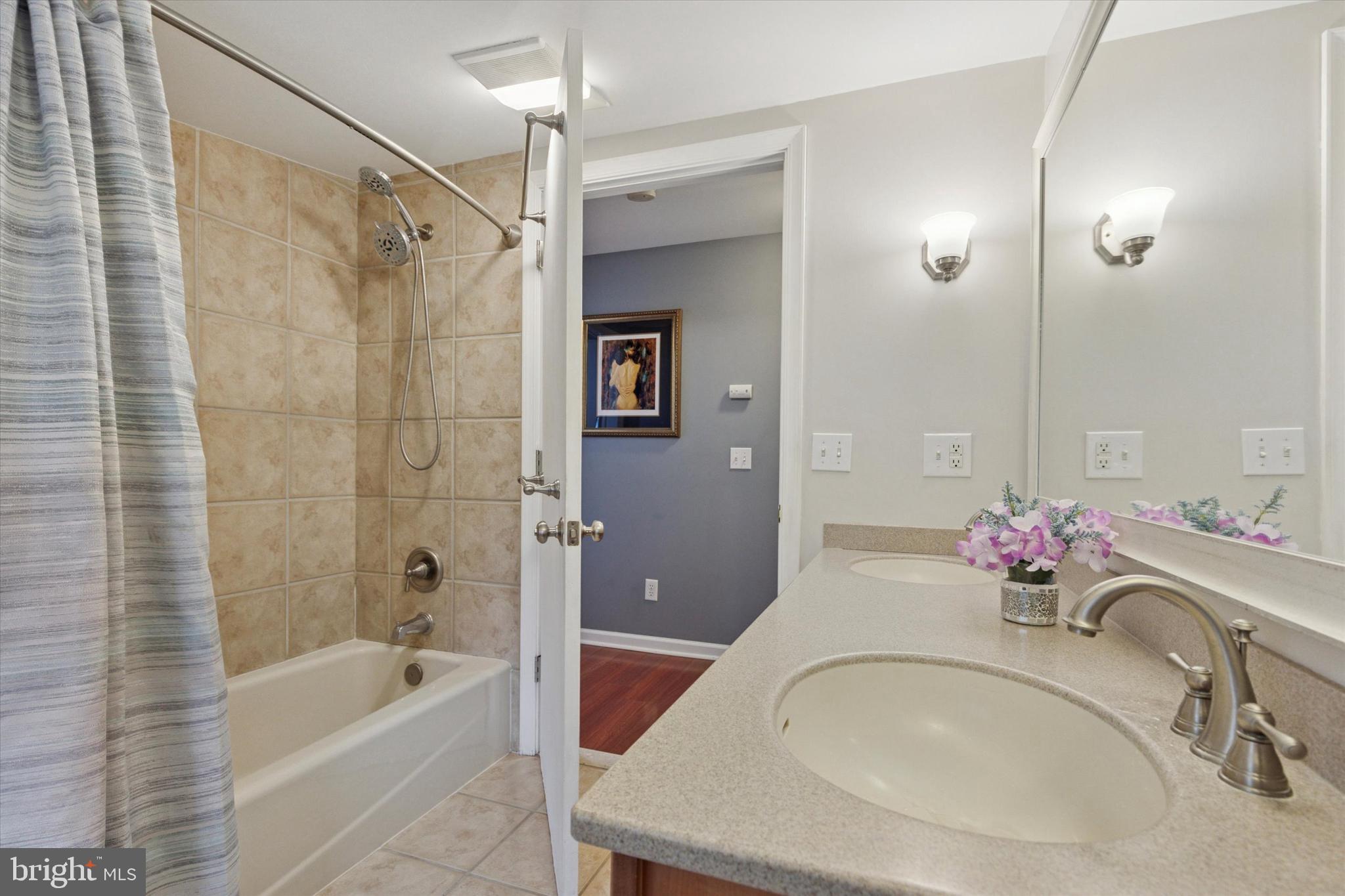 3 Buttonwood Avenue Malvern, PA 19355 - Photo 17 of 25 a bathroom with a tub sink and mirror