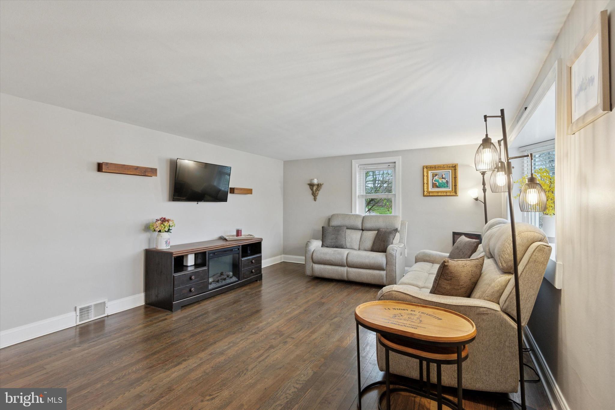 3 Buttonwood Avenue Malvern, PA 19355 - Photo 3 of 25 a living room with furniture and a flat screen tv