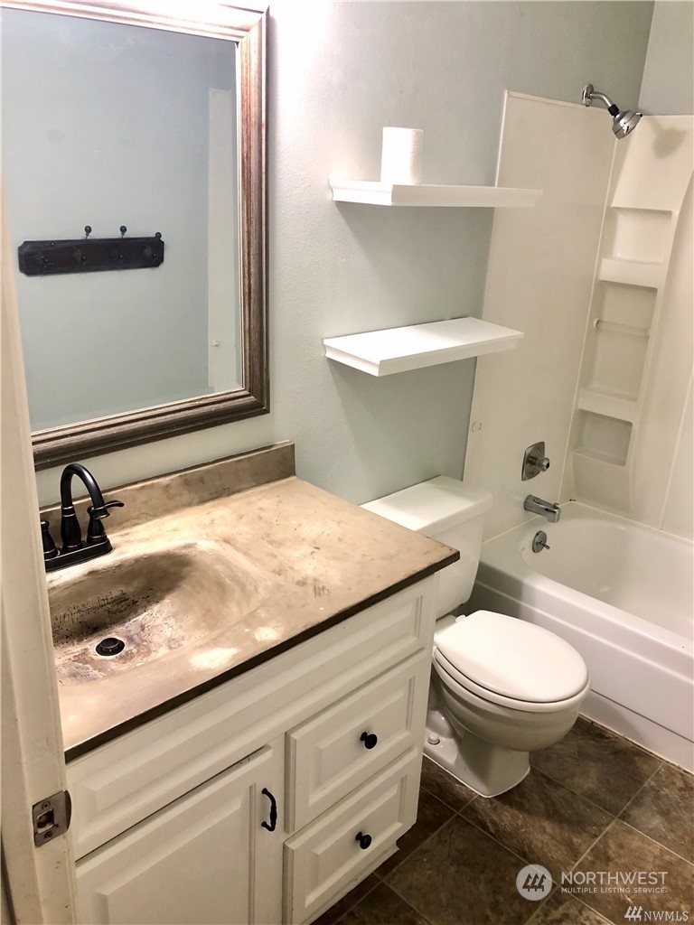 820 Cady Road, Unit B103 Everett, WA 98203 - Photo 9 of 16 a bathroom with a sink and a toilet
