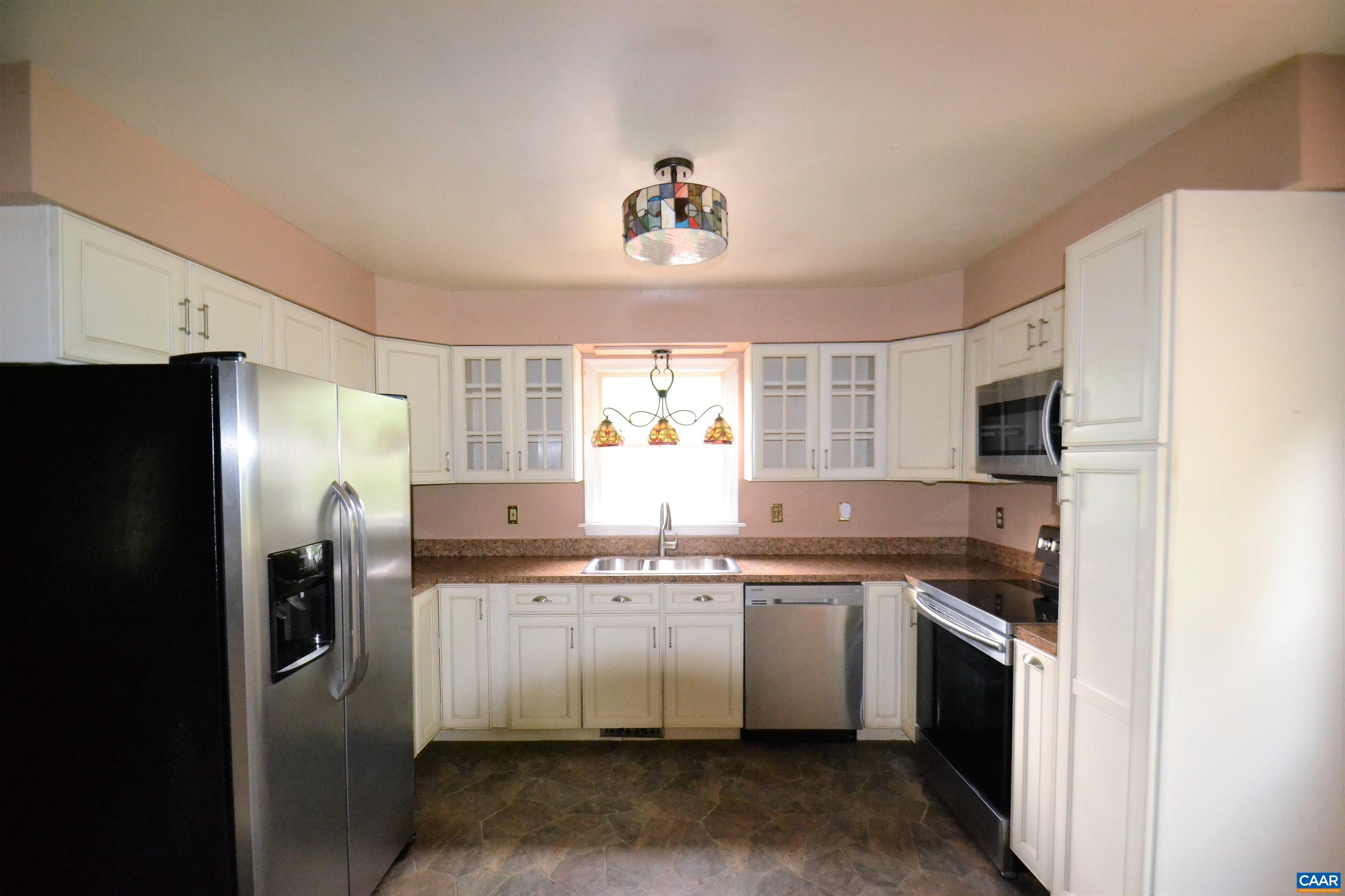 183 Circle Road Stanardsville, VA 22973 - Photo 7 of 57 a kitchen with a sink stainless steel appliances and cabinets