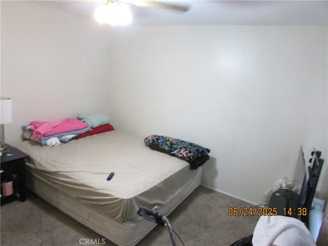 a bedroom with a bed and a table