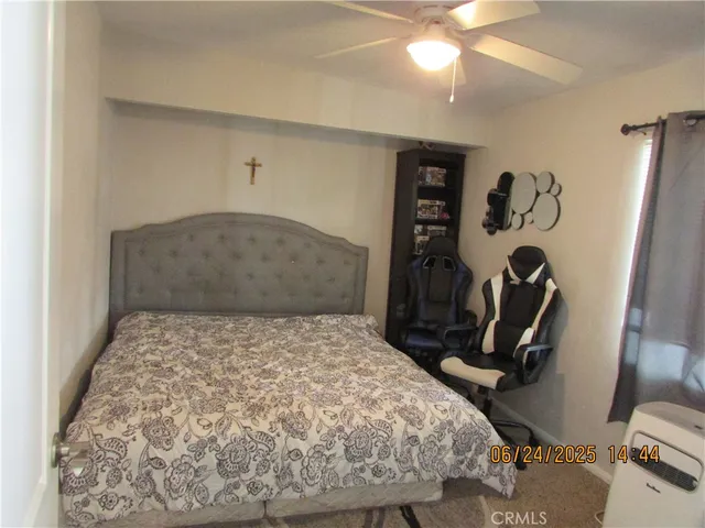 a bedroom with a bed and cabinets
