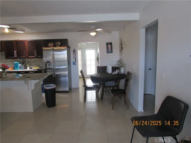 a kitchen with a refrigerator and a sink
