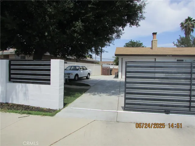 a view of a house with a street from a balcony