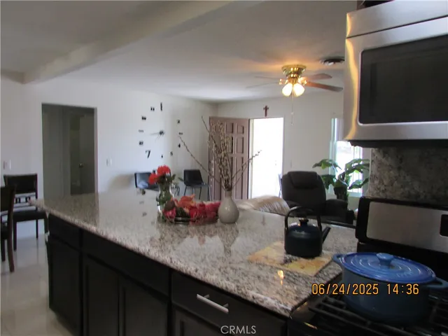 a kitchen with granite countertop lots of counter top space
