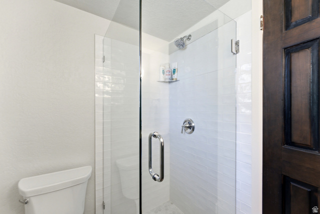 2635 Little Kate Road, Unit 21 Park City, UT 84060 - Photo 21 of 39 Bathroom with a stall shower, a textured ceiling, and a textured wall