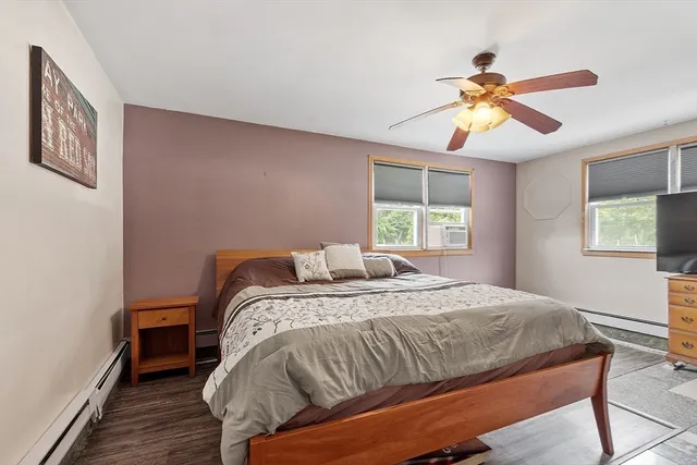 a view of house with swimming pool and a yard