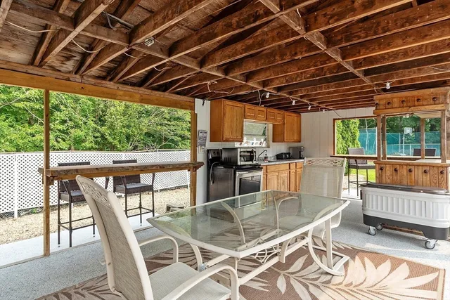 an aerial view of a house with a swimming pool