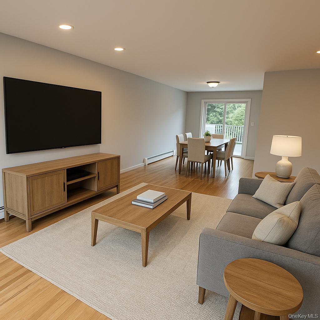 324 Buckingham Road Cedarhurst, NY 11516 - Photo 9 of 12 Living room featuring recessed lighting, light wood-style flooring, and a baseboard radiator