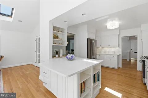 a bathroom with a sink mirror and toilet