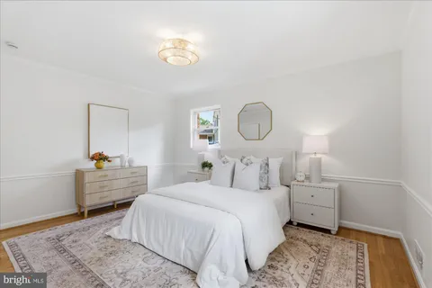 a bed room with a bed and a window
