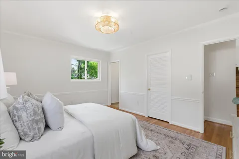 a living room with furniture flat screen tv and a fireplace