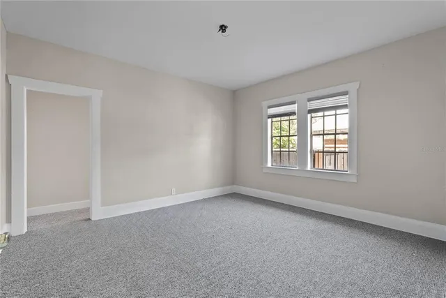a view of an empty room with a window
