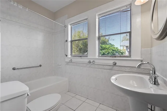 a bathroom with a sink toilet and tub