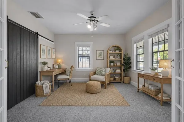 a living room with furniture and a window