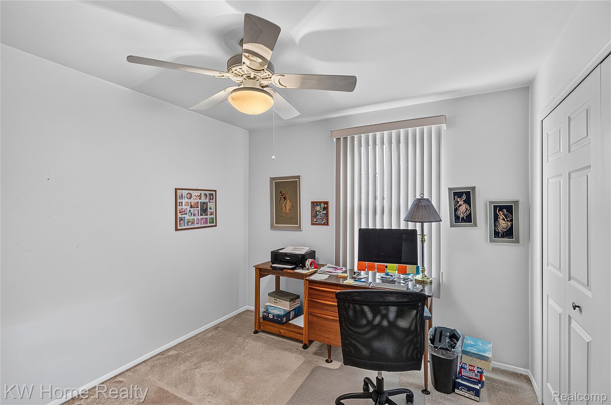 3216 High Pointe Ridge Road Lake Orion, MI 48359 - Photo 17 of 24 Bedroom #2 is used as a home office, featuring neutral wall paint, ceiling fan with integrated lighting, window with vertical blinds, and light tone carpeting