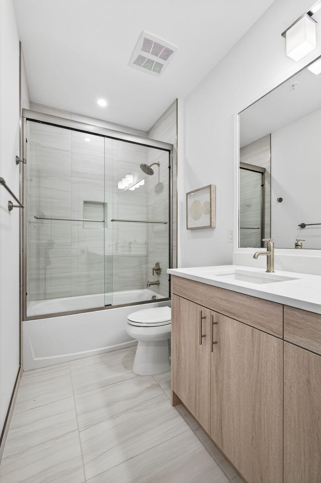 115 Water Pointe Place, Unit 35 Jupiter, FL 33477 - Photo 29 of 42 a bathroom with a double vanity sink toilet and shower