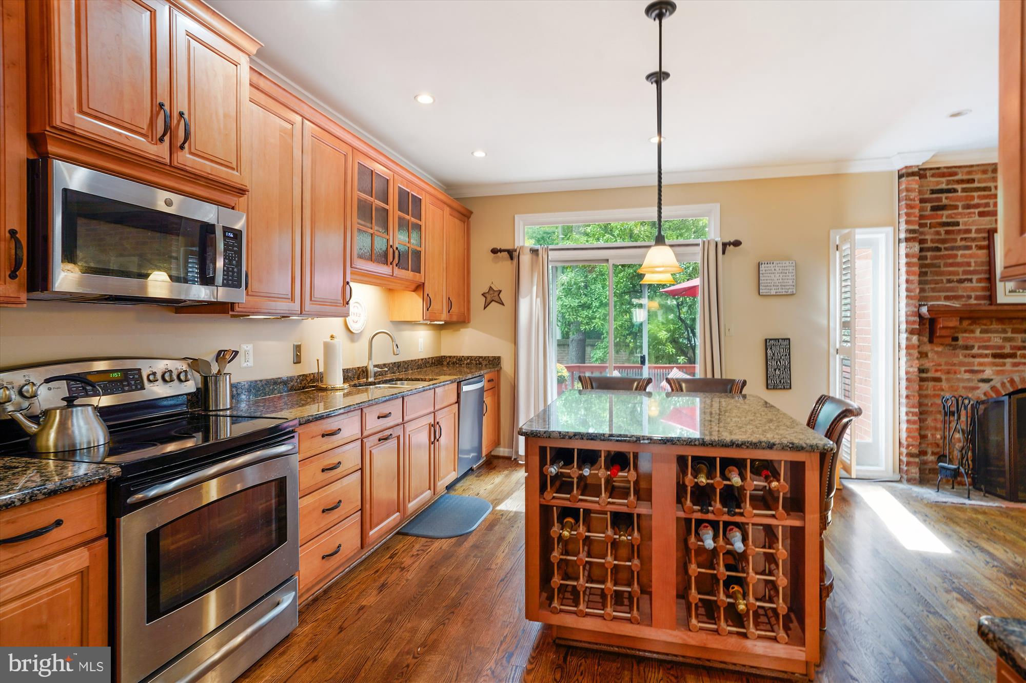 3922 North Glebe Road Arlington, VA 22207 - Photo 20 of 46 a open kitchen with stainless steel appliances granite countertop a stove a sink dishwasher and cabinets with wooden floor