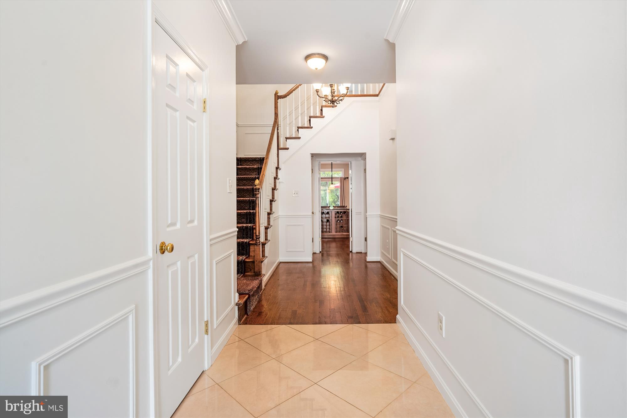 3922 North Glebe Road Arlington, VA 22207 - Photo 9 of 46 a view of a hallway with wooden floor and staircase