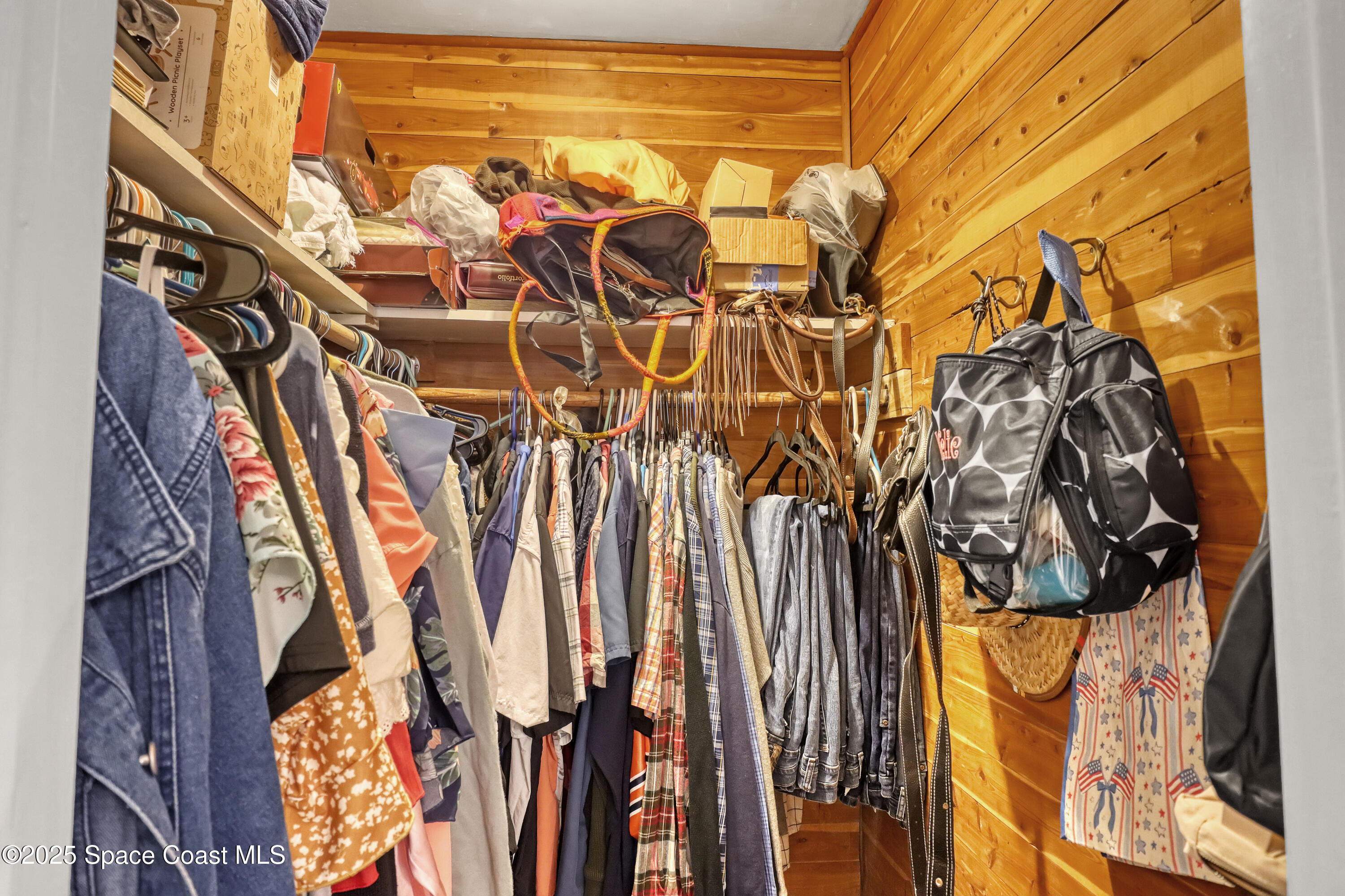 2307 Country Club Road Melbourne, FL 32901 - Photo 20 of 50 a view of walk in closet with clothes