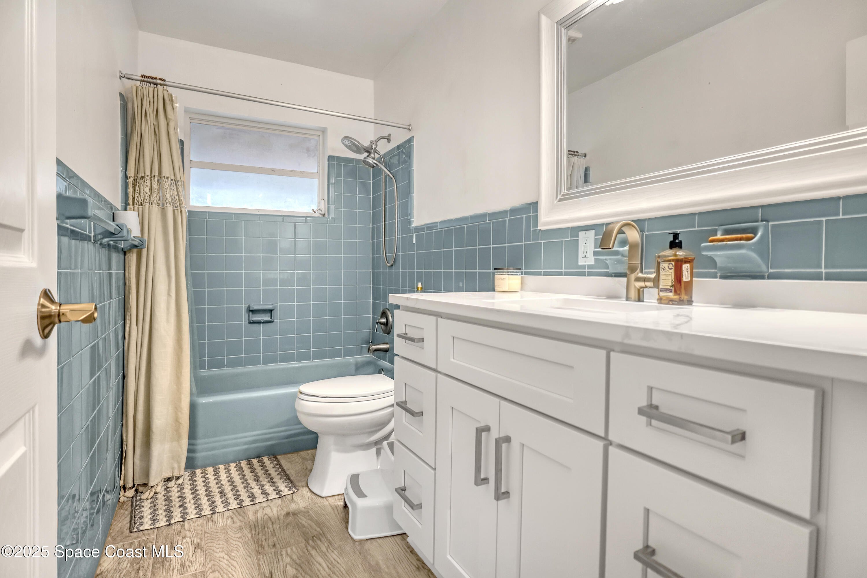 2307 Country Club Road Melbourne, FL 32901 - Photo 24 of 50 a bathroom with a sink toilet and shower