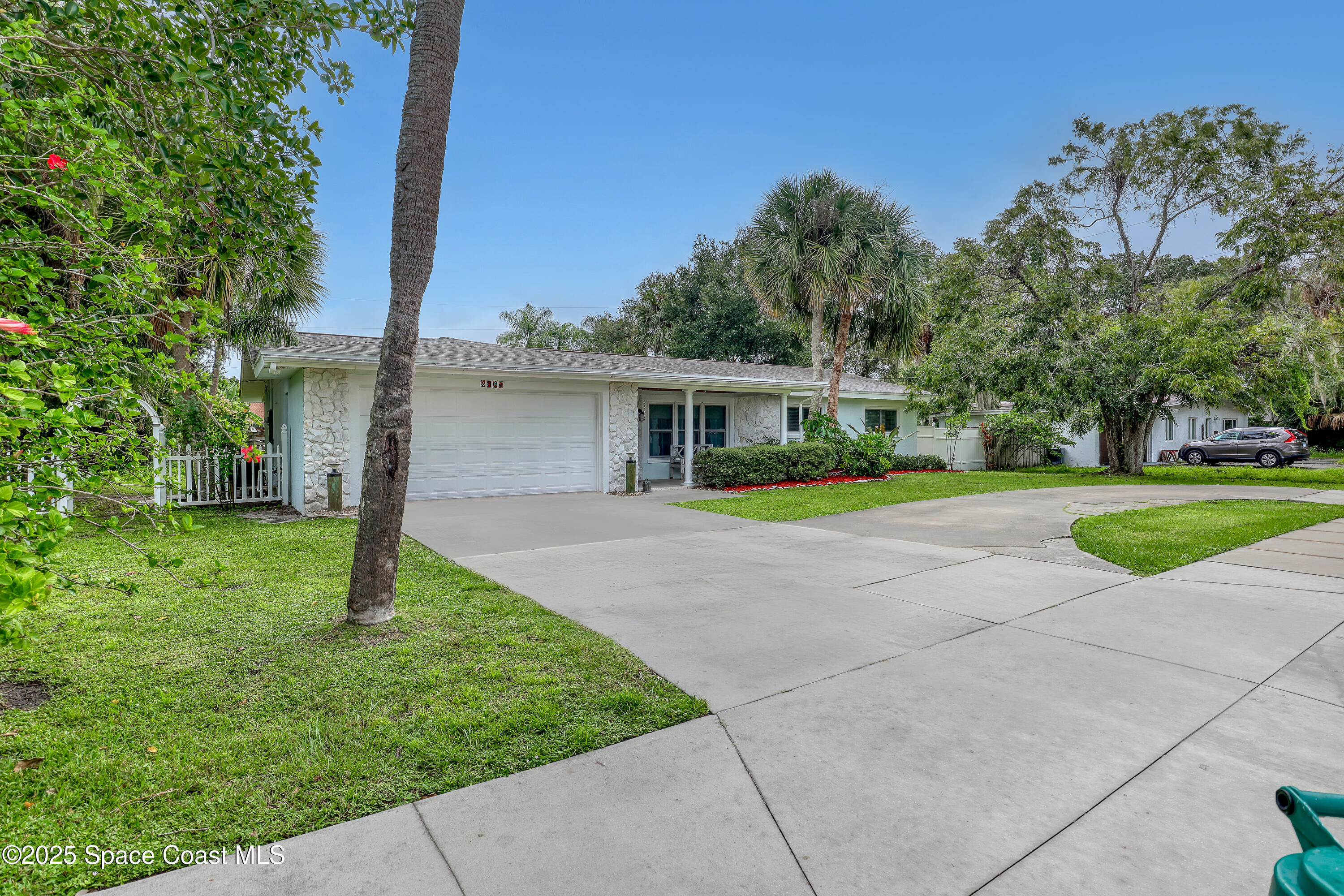 2307 Country Club Road Melbourne, FL 32901 - Photo 45 of 50 a view of house with a yard