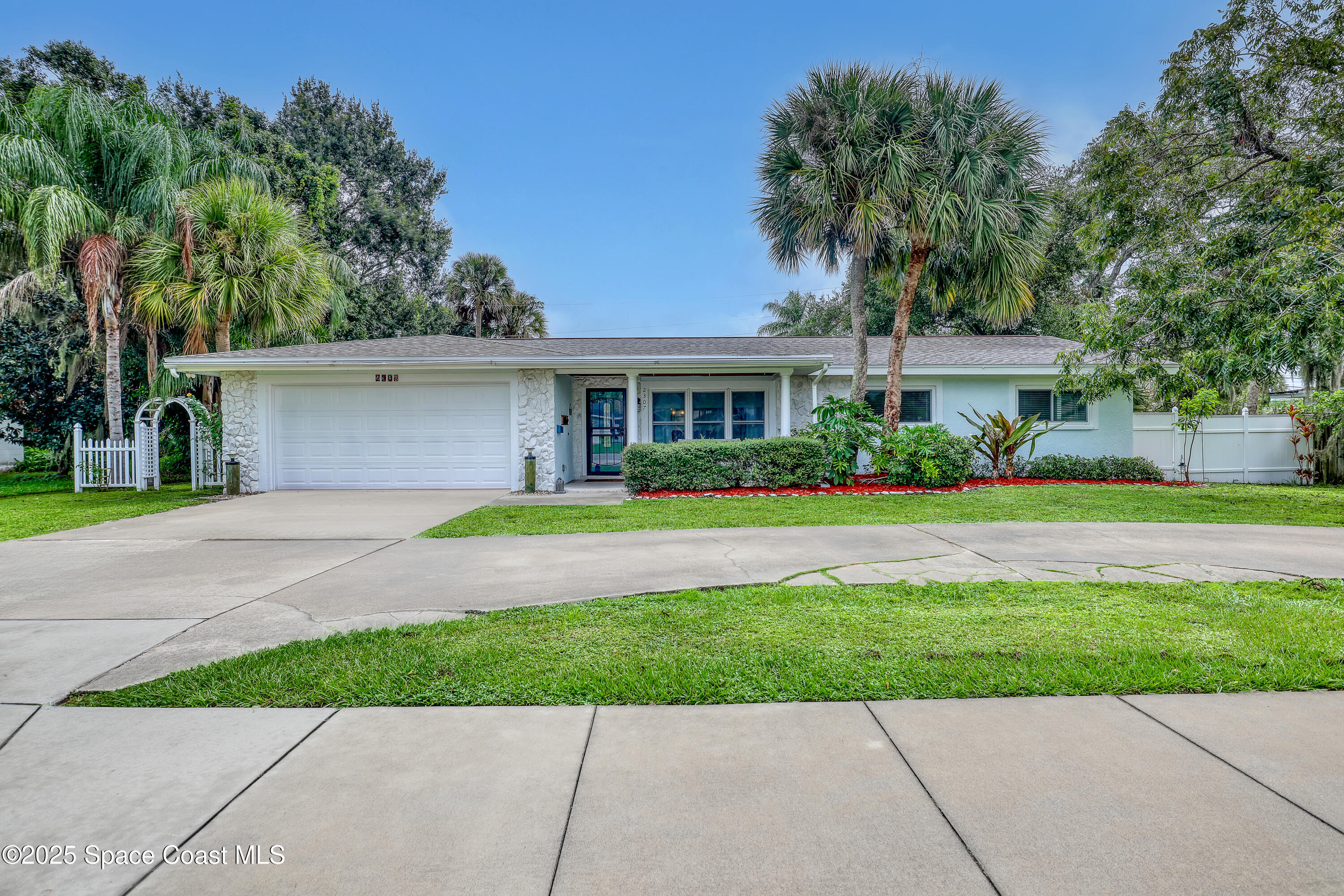 2307 Country Club Road Melbourne, FL 32901 - Photo 46 of 50 a front view of house with yard and green space