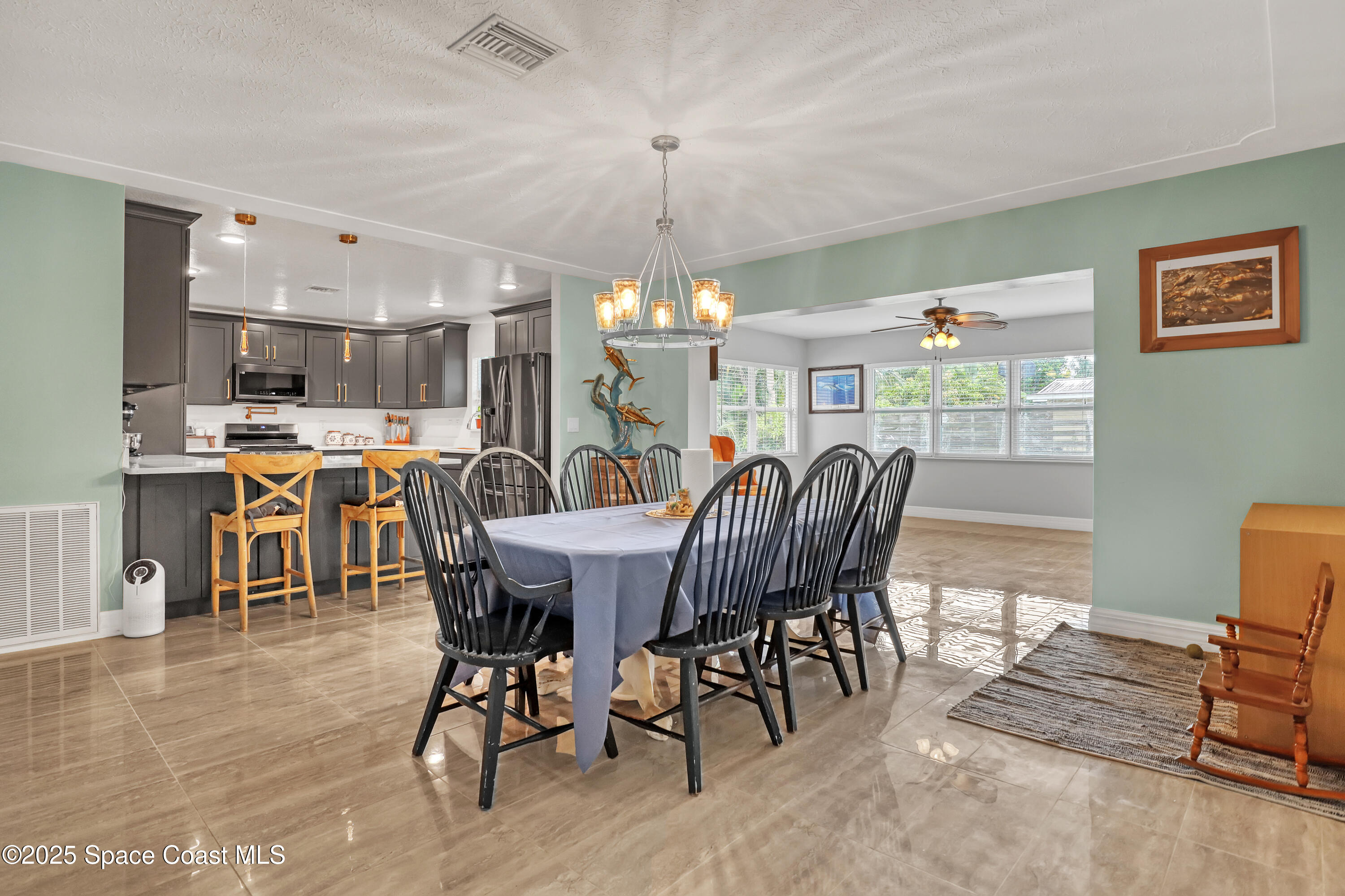 2307 Country Club Road Melbourne, FL 32901 - Photo 6 of 50 a view of a dining room with furniture window and wooden floor